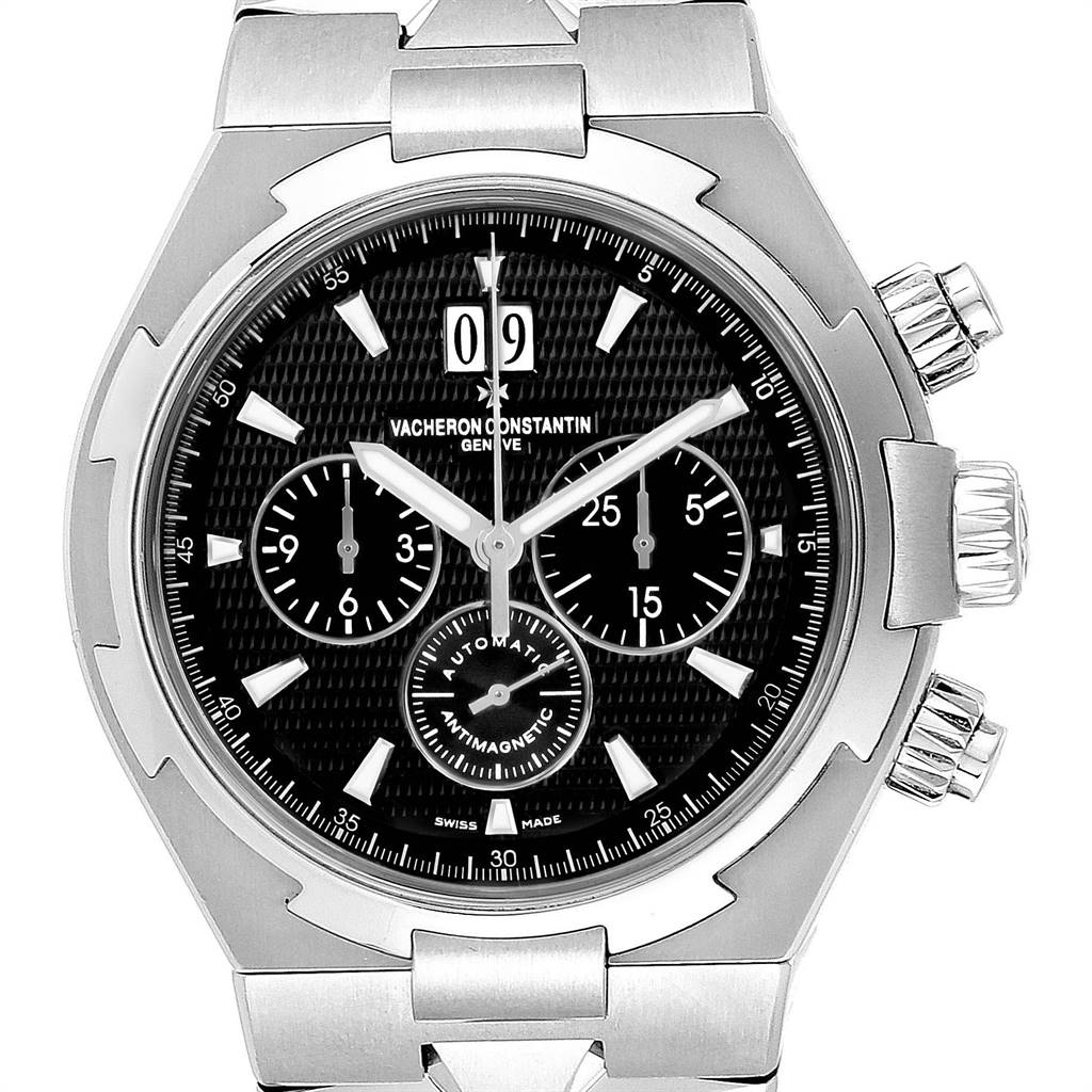 The Vacheron Constantin Overseas 49150.B01A.9097 Men's Stainless Steel Black Dial 49150.B01A.9097 Men's Stainless Steel Black Dial watch is shown from a front angle, highlighting its dial, bezel, crown, and pushers.