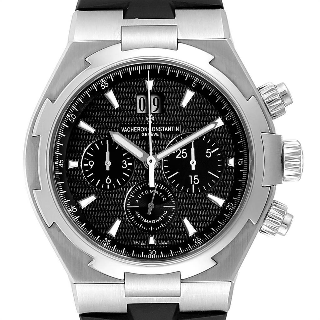 The image shows a Vacheron Constantin Overseas 49150 Men's Stainless Steel Black Dial 49150 Men's Stainless Steel Black Dial watch face, highlighting its dials, bezel, and chronograph pushers from a frontal angle.