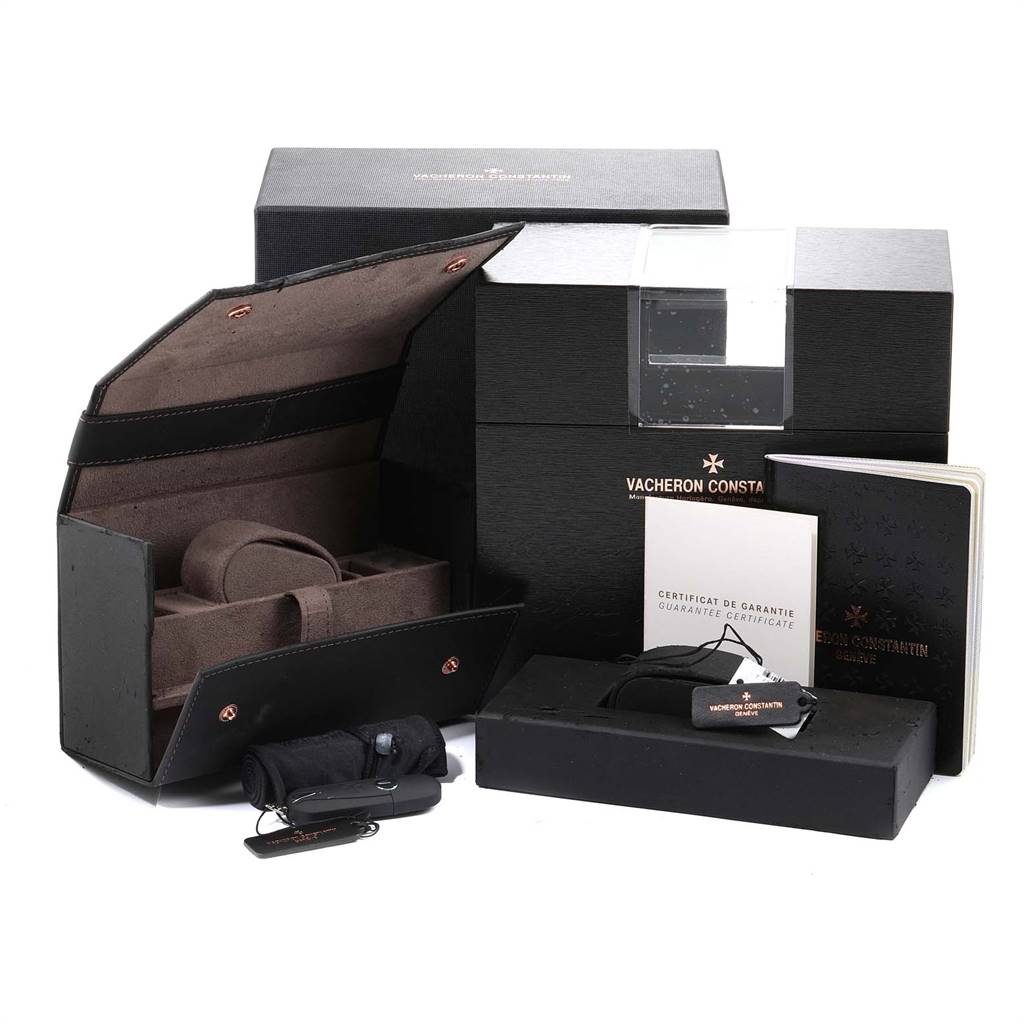 The image shows the packaging, warranty card, and accessories for a Vacheron Constantin Overseas 49150/000W-9501 Men's Stainless Steel Grey Dial 49150/000W-9501 Men's Stainless Steel Grey Dial model watch.