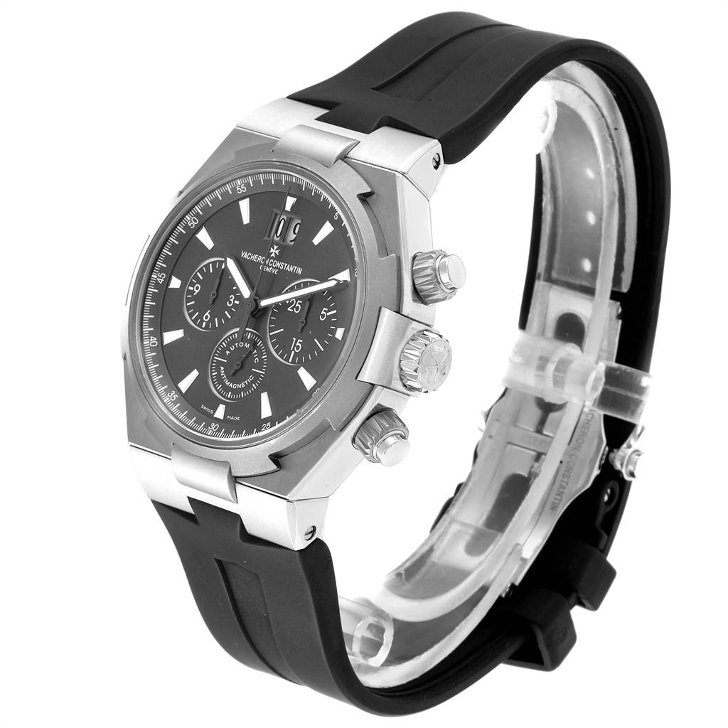The Vacheron Constantin Overseas 49150/000W-9501 Men's Stainless Steel Grey Dial 49150/000W-9501 Men's Stainless Steel Grey Dial watch is shown at a slight angle, displaying the front face, buttons, and black rubber strap.
