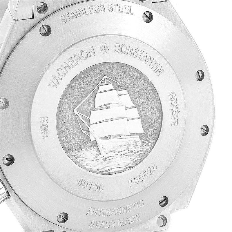 The image shows the engraved case back of a Vacheron Constantin Overseas watch, highlighting its antimagnetic and stainless steel features.