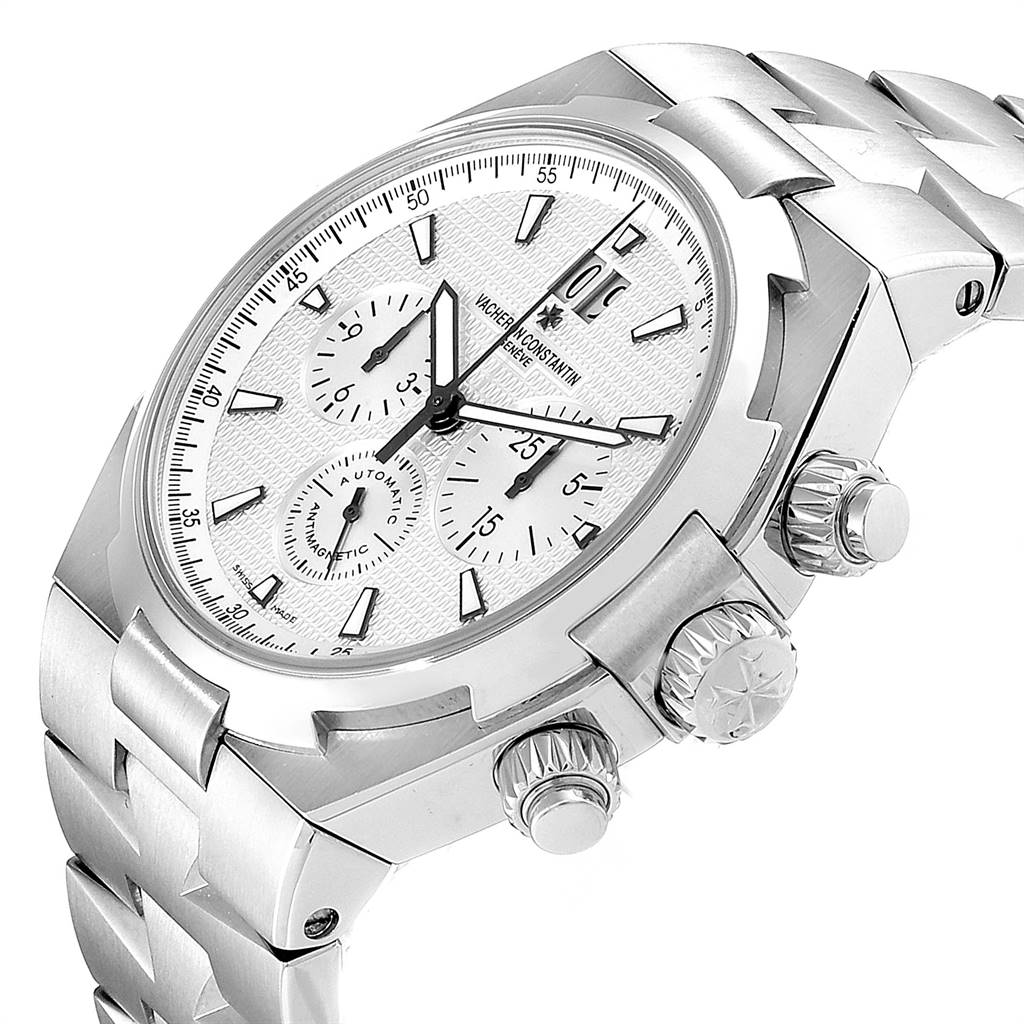The image shows a Vacheron Constantin Overseas 49150 Men's Stainless Steel Silver Dial 49150 Men's Stainless Steel Silver Dial watch at a three-quarter angle, showcasing its dial, crown, pushers, and part of the bracelet.
