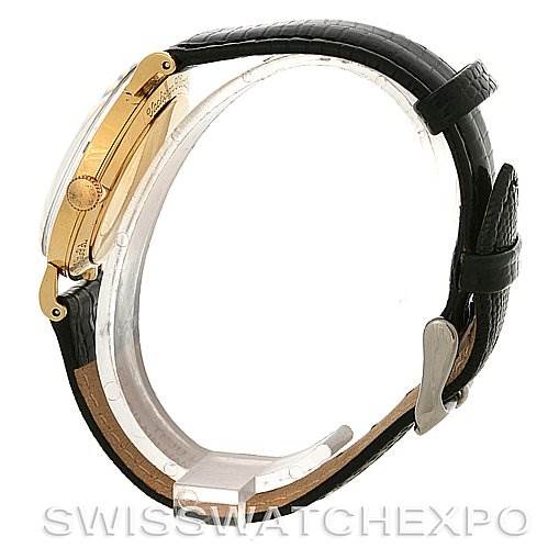The image shows a side view of a Vintage Jaeger LeCoultre watch, highlighting its gold case, crown, and black leather strap.