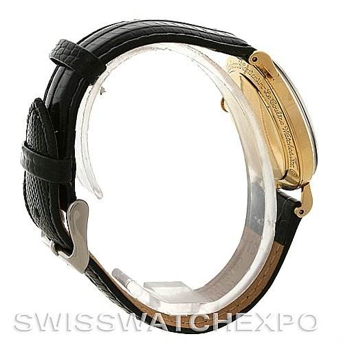 This image shows a side view of the Jaeger LeCoultre Vintage Yellow Gold Black Dial Yellow Gold Black Dial watch, focusing on the case and black leather strap.