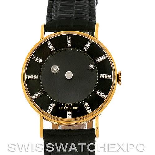 This image shows a front view of a Vintage Jaeger LeCoultre watch featuring a gold case and a black leather strap.