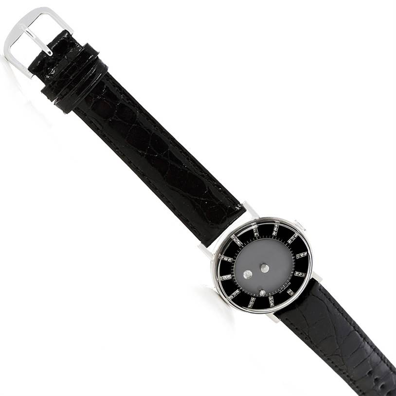 The image shows a top view of a Vintage Vacheron Constantin watch, highlighting the dial and black leather strap.