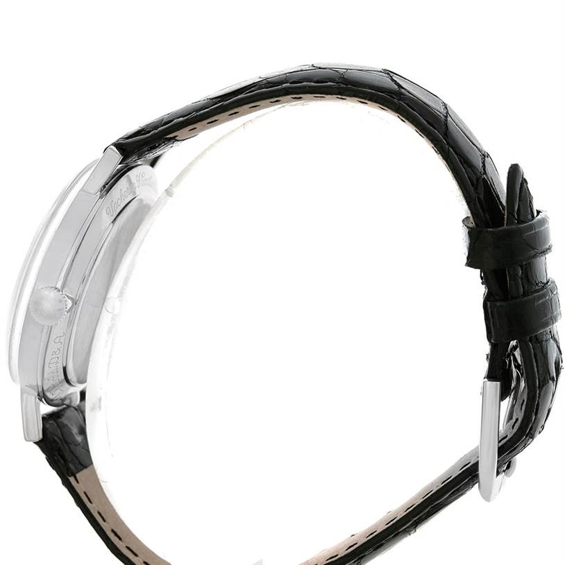 The image shows the side view of a Vintage Vacheron Constantin watch, highlighting its black leather strap and metal buckle.