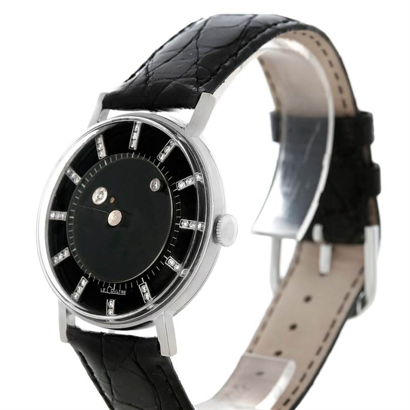 This image shows a side angle of the vintage Vacheron Constantin watch, highlighting the black dial, silver case, and black leather strap.