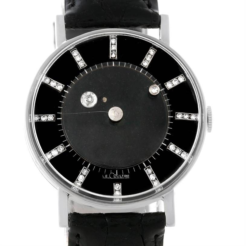 The image shows a front view of a Vintage Vacheron Constantin watch with a black dial, diamond hour markers, and a black leather strap.
