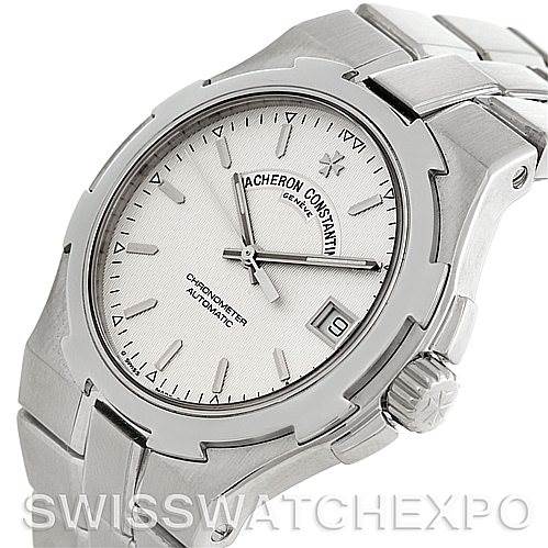 The Vacheron Constantin Overseas 42042 Men's Stainless Steel Silver Dial 42042 Men's Stainless Steel Silver Dial watch is shown at a slight angle, highlighting the face, bezel, case, and part of the bracelet.