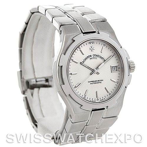 The image shows a front and side view of a Vacheron Constantin Overseas 42042 Men's Stainless Steel Silver Dial 42042 Men's Stainless Steel Silver Dial watch, with a visible face, dial, and bracelet.