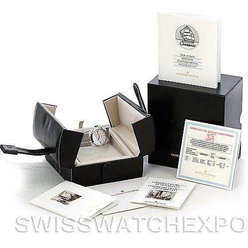The image shows a Vacheron Constantin Overseas 42042 Men's Stainless Steel Silver Dial 42042 Men's Stainless Steel Silver Dial model watch at an angle within its open box, alongside various documents and accessories.