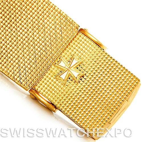 This image shows a close-up view of the textured gold clasp of a Vintage Vacheron Constantin watch.
