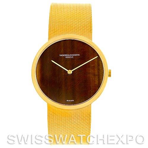 This image shows a front angle of a Vintage Vacheron Constantin watch with a gold mesh band and a dark dial.