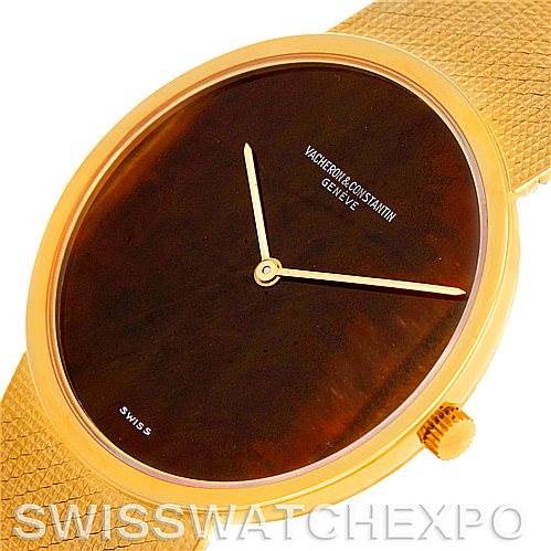 The image shows a close-up angle of the Vacheron Constantin Vintage 7291 Men's Yellow Gold Brown Dial 7291 Men's Yellow Gold Brown Dial watch, highlighting its dial, hands, crown, and part of the strap.