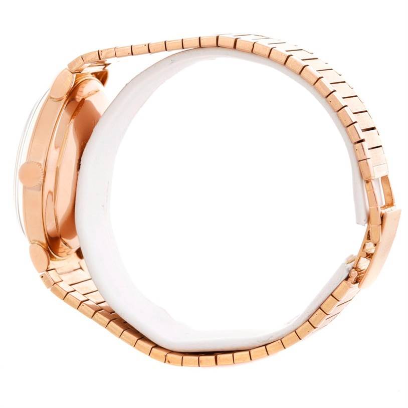 The image shows a side view of a Vintage Vacheron Constantin watch, highlighting its gold case and part of its metal band.