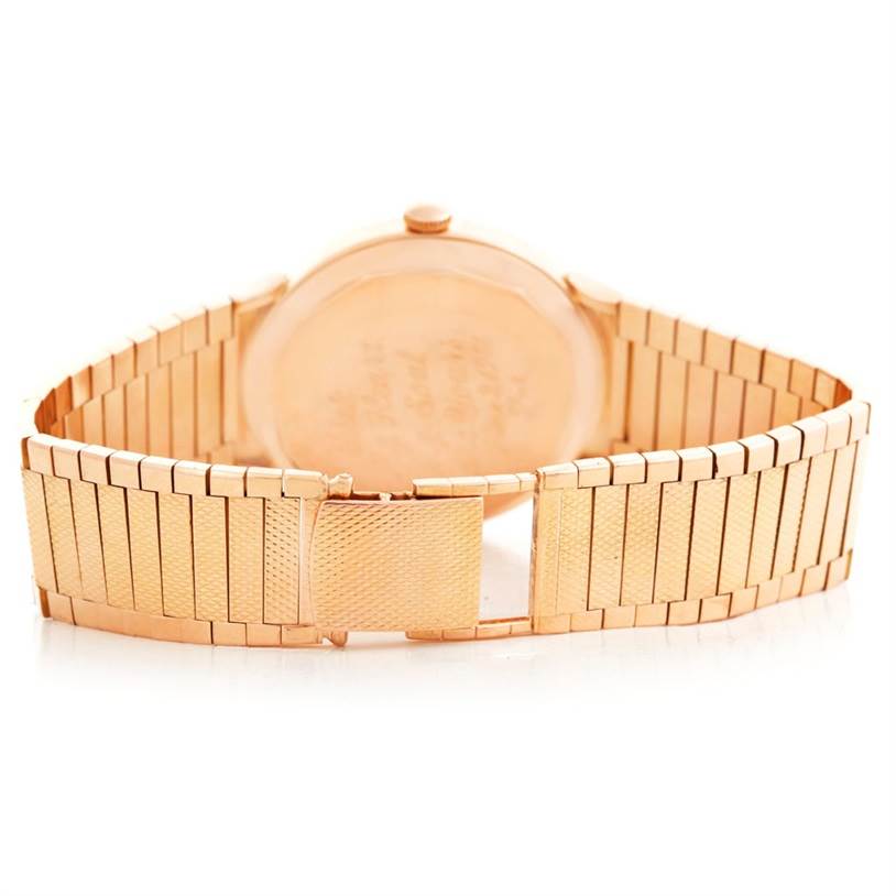 The image shows the back view of a Vacheron Constantin Vintage Men's Rose Gold Beige Dial Men's Rose Gold Beige Dial watch, highlighting its gold case and bracelet.