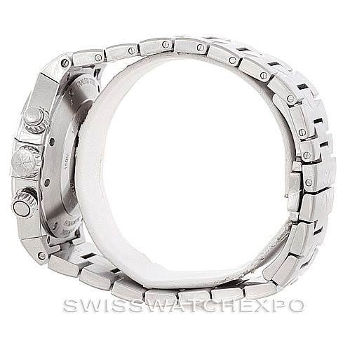 The image shows a Vacheron Constantin Overseas 49150 Men
s Stainless Steel Silver Dial 49150 Men
s Stainless Steel Silver Dial model watch from a side angle, highlighting the case, crown, and bracelet.