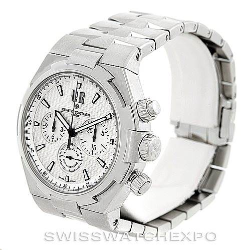 The image shows the Vacheron Constantin Overseas 49150 Men
s Stainless Steel Silver Dial 49150 Men
s Stainless Steel Silver Dial watch at a three-quarter angle highlighting the face, case, crown, and metal bracelet.