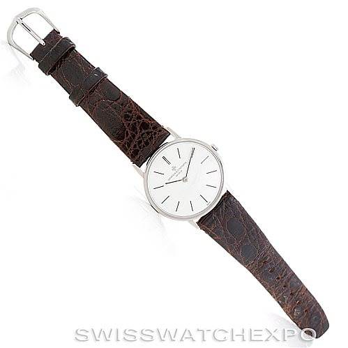 This image shows a Vacheron Constantin Vintage 7697 Men's White Gold Silver Dial 7697 Men's White Gold Silver Dial model watch at a slight angle, highlighting its white dial face and brown leather strap.