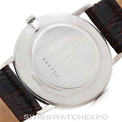 The image shows the back of a Vintage Vacheron Constantin watch, highlighting the case back, serial number, and leather straps.