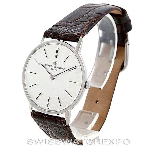 The image shows a side-angle view of a Vintage Vacheron Constantin watch featuring a round face and a brown leather strap.