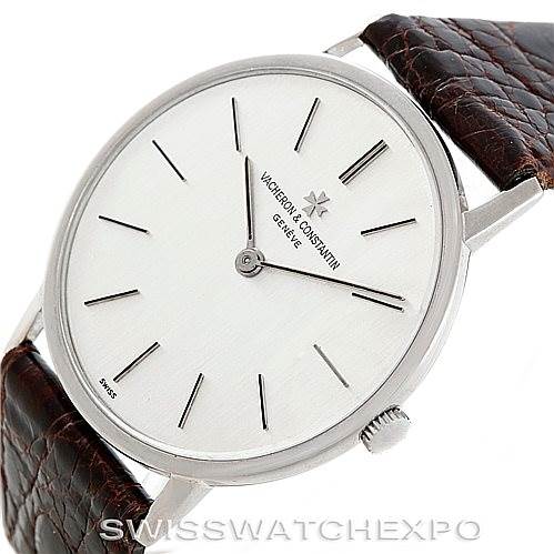 The image shows a Vintage Vacheron Constantin watch from an oblique angle, displaying the dial, crown, and partial leather strap.