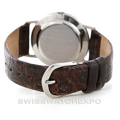 This image shows the backside and strap of a Vintage Vacheron Constantin watch, featuring a textured brown leather band and buckle.