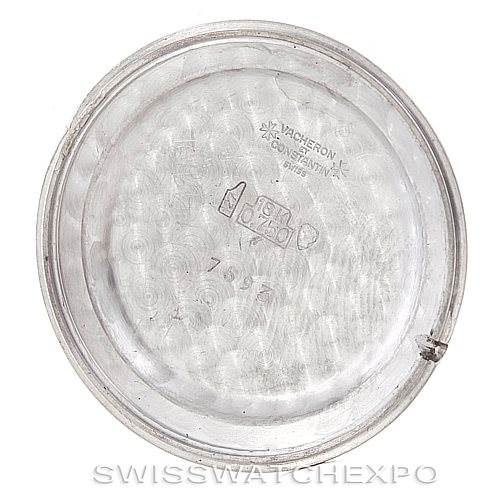 The image shows the inner case back of a vintage Vacheron Constantin watch, featuring engravings and hallmarks.