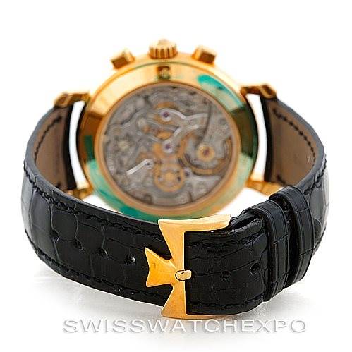 The image shows the back view of the Vacheron Constantin Historiques 47111 Men's Yellow Gold Silver Dial 47111 Men's Yellow Gold Silver Dial model, highlighting its intricate movement and black leather strap.