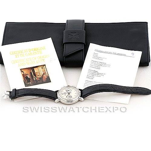The image shows a Vacheron Constantin Historiques 47101 Men's Platinum Silver Dial 47101 Men's Platinum Silver Dial watch laid flat with its strap, alongside its certificate of origin and a booklet, accompanied by a black carrying case.