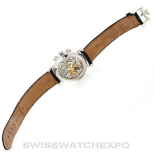 The image shows the back view of a Vacheron Constantin Historiques 47101 Men's Platinum Silver Dial 47101 Men's Platinum Silver Dial watch with its mechanical movement visible and a brown leather strap.