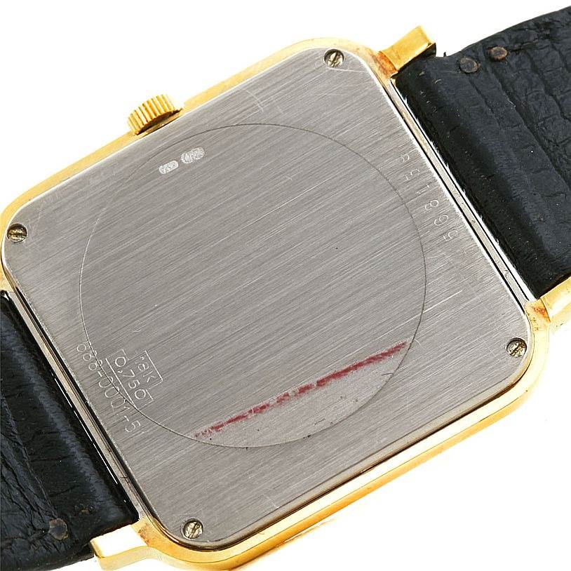 The image shows the back of a Vintage Vacheron Constantin watch, highlighting its case back, crown, screws, and leather strap attachments.