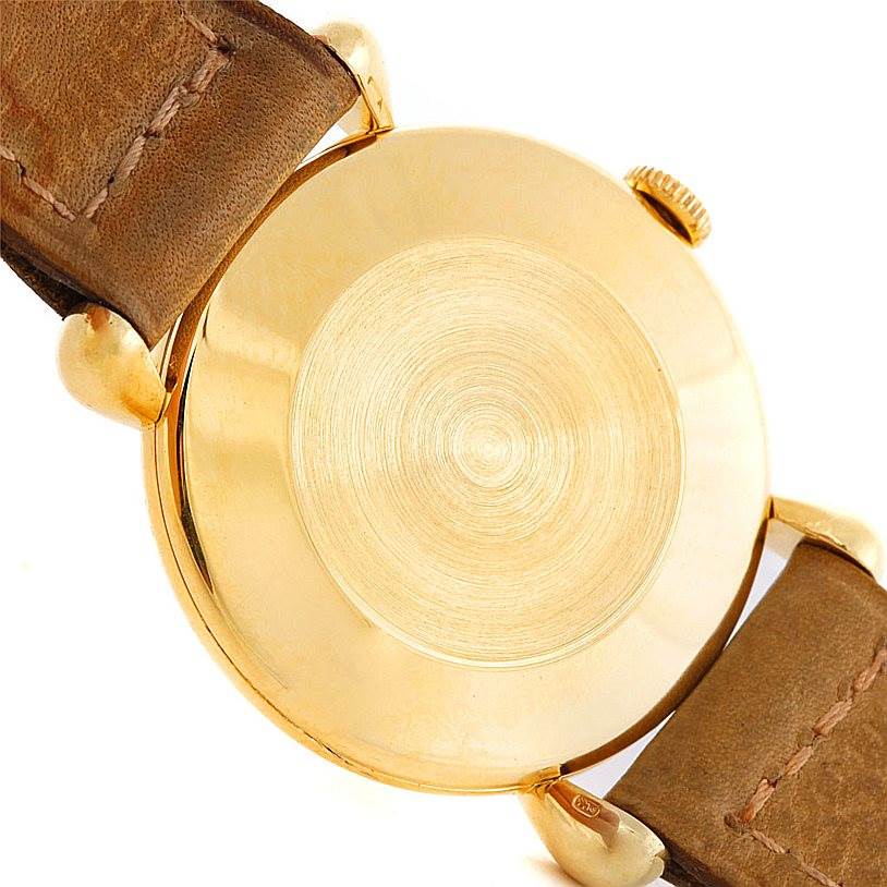 This image shows the back view of a Vintage Vacheron Constantin watch, highlighting its case back, crown, and leather strap.