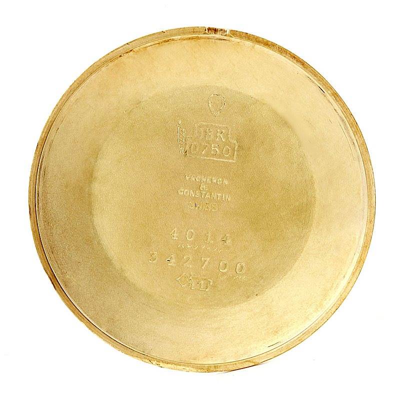 This image shows the inside case back of a Vintage Vacheron Constantin watch, featuring inscriptions and hallmark details.