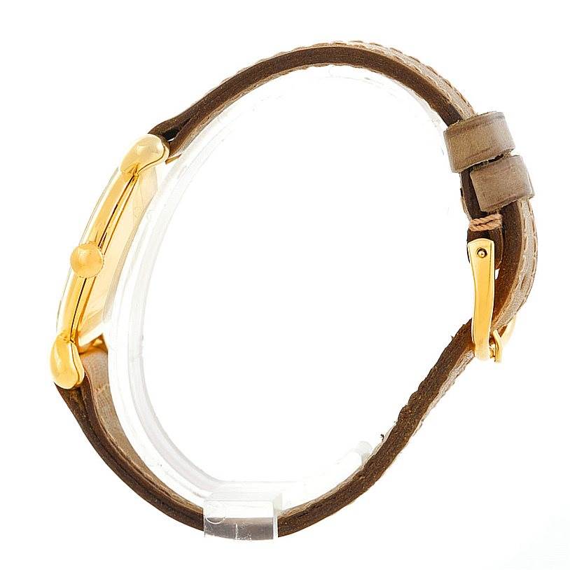 This is a side view of a Vintage Vacheron Constantin watch, showing the gold case, crown, and brown leather strap with buckle.