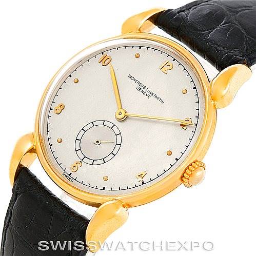This image shows the face and part of the strap of a Vintage Vacheron Constantin watch, angled to highlight the dial and gold case.