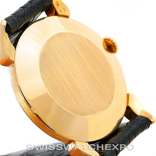 The image shows the back case and crown of a vintage Vacheron Constantin watch from an angled side view.