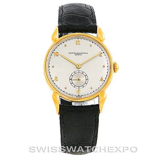 This image shows a front view of the Vintage Vacheron Constantin watch, highlighting its dial, golden case, and black leather strap.