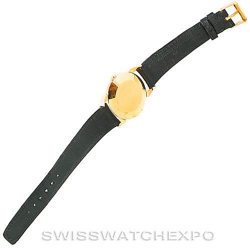 The image shows the back view of a Vintage Vacheron Constantin watch, highlighting the leather strap and gold-colored case.