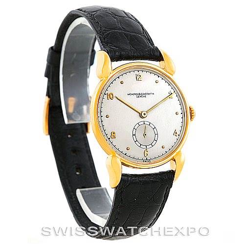 The image shows a side-angle view of a Vacheron Constantin Vintage Men's Yellow Gold Silver Dial Men's Yellow Gold Silver Dial watch with a black leather strap and gold case.