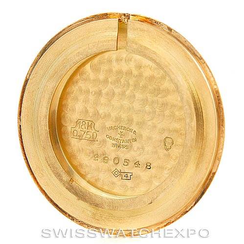 The image shows the inside of the case back of a Vintage Vacheron Constantin watch, featuring engravings and hallmarks.