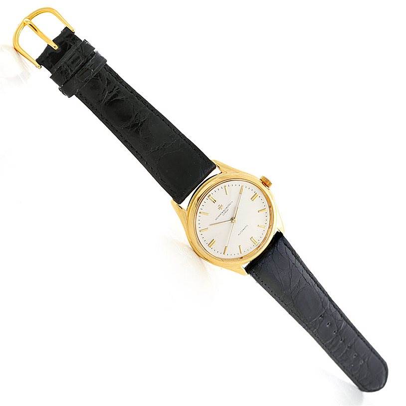 The image shows a Vacheron Constantin Vintage 4870 Men's Yellow Gold Silver Dial 4870 Men's Yellow Gold Silver Dial model watch at an angled top view, displaying its dial, case, and leather strap.