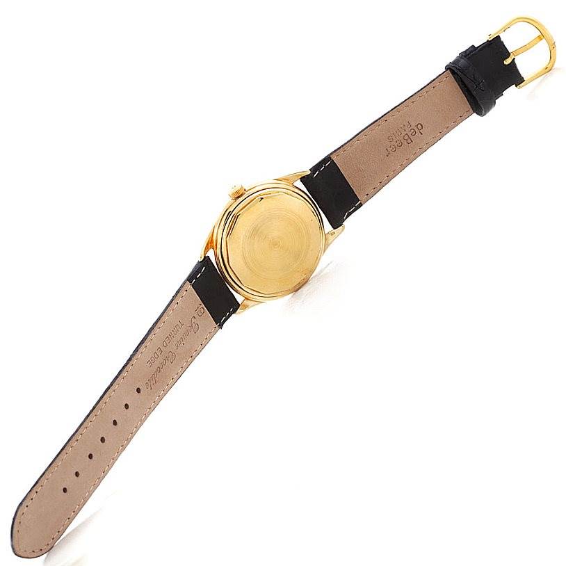 The image shows the back case and strap of a Vintage Vacheron Constantin watch, taken from a top-down angle.