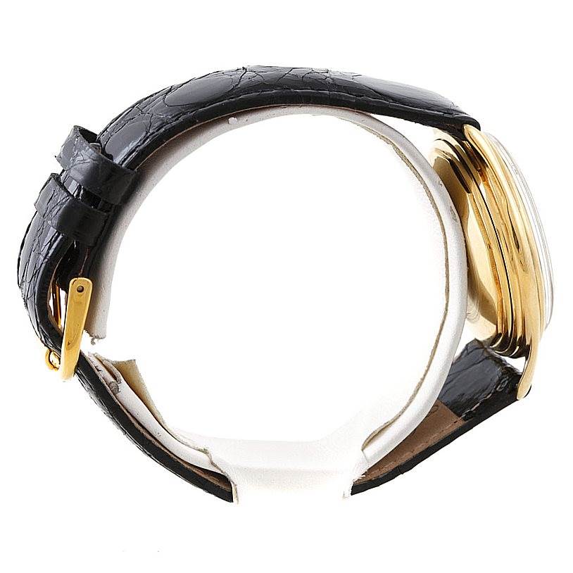 The image shows a side view of a Vintage Vacheron Constantin watch, highlighting the black leather strap and gold case.