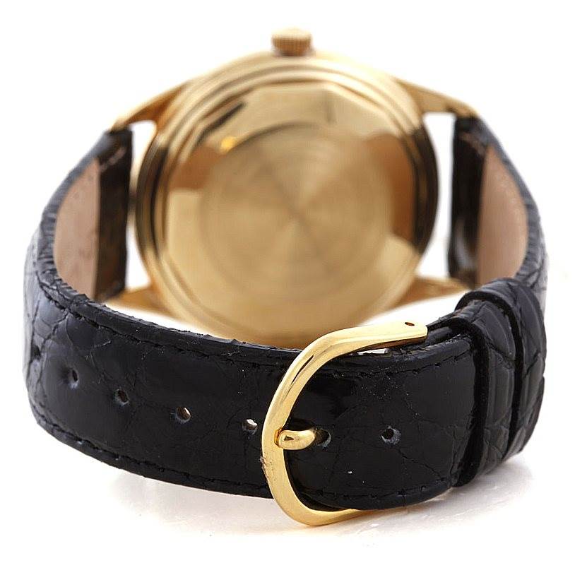 The image shows the back case and black leather strap of a Vintage model Vacheron Constantin watch.