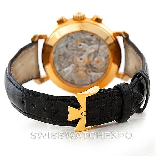 The image shows the back view of a Vacheron Constantin Historiques 47101/4 Men's Yellow Gold Black Dial 47101/4 Men's Yellow Gold Black Dial watch, highlighting the movement and black leather strap with a gold clasp.