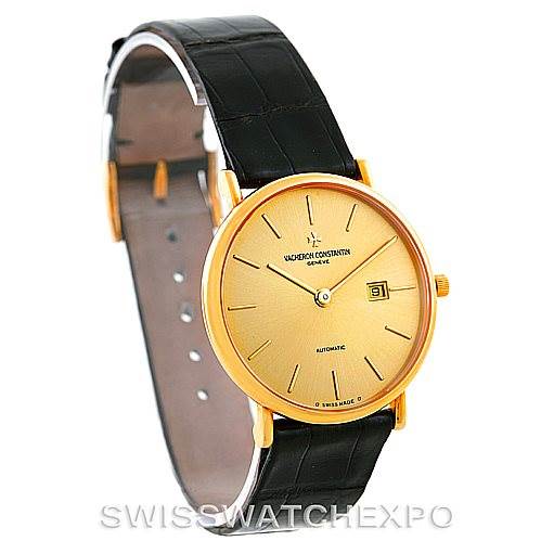The image shows a side-angle view of the Vacheron Constantin Vintage 48002 Men
s Yellow Gold Champagne Dial 48002 Men
s Yellow Gold Champagne Dial watch, highlighting its round gold dial, black leather strap, and date window.