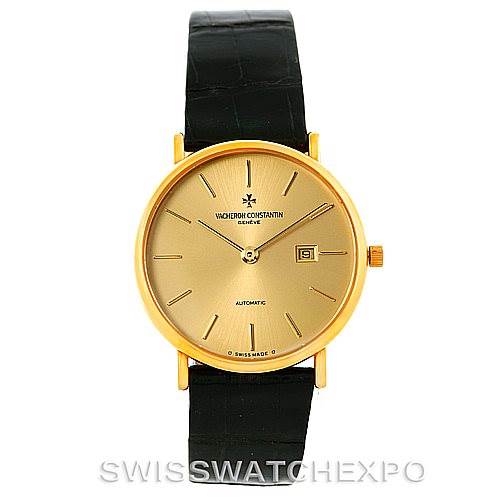 The image shows a frontal view of a Vacheron Constantin Vintage 48002 Men
s Yellow Gold Champagne Dial 48002 Men
s Yellow Gold Champagne Dial model watch with a gold dial, black leather strap, and an automatic movement.