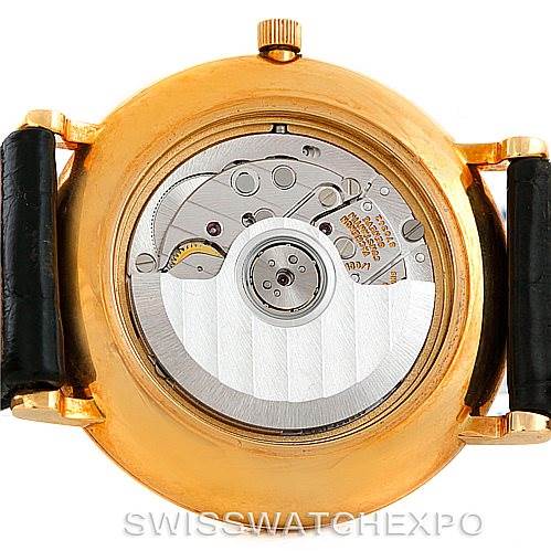 The image shows the back view of a Vintage Vacheron Constantin watch, highlighting its mechanical movement and inner workings.